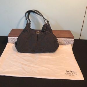 Black Coach purse, with bag. Red lining inside.